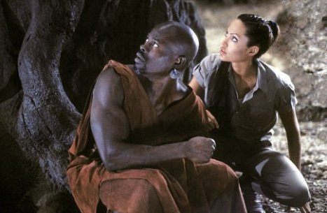 Angelina and Djimon in the forest with man eating monsters